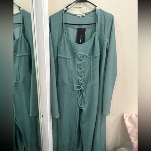 2 piece jumpsuit new with tags comes with a cardigan